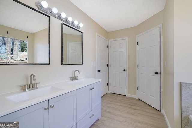 bathroom with vanity and hardwood / wood-style floors