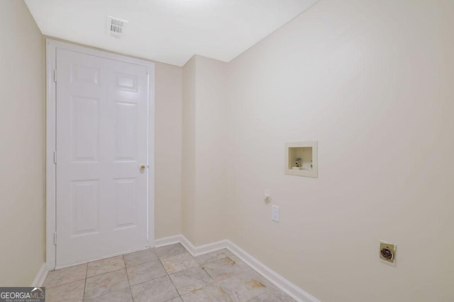 laundry room with electric dryer hookup, light tile patterned floors, and hookup for a washing machine