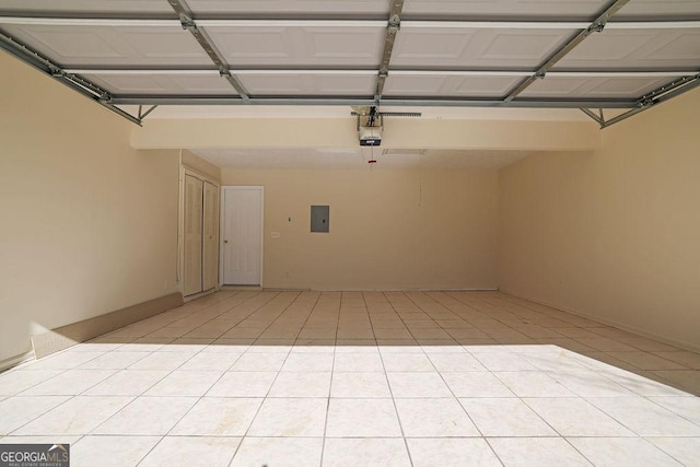 garage featuring a garage door opener and electric panel