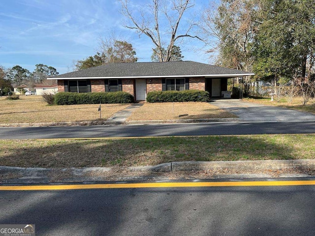 single story home featuring a carport