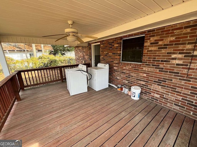 wooden deck featuring washer / clothes dryer and ceiling fan