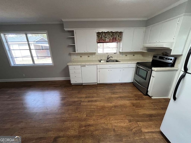 kitchen featuring sink, dark wood-type flooring, white cabinets, and white appliances