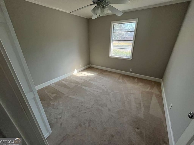 carpeted empty room with ceiling fan