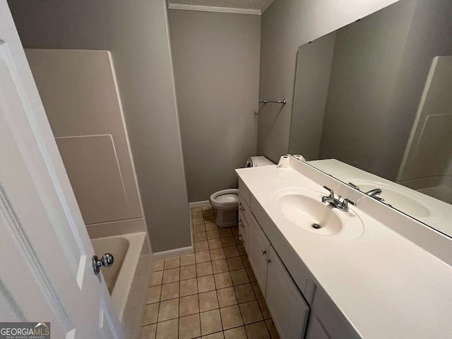 bathroom with tile patterned flooring, vanity, and toilet