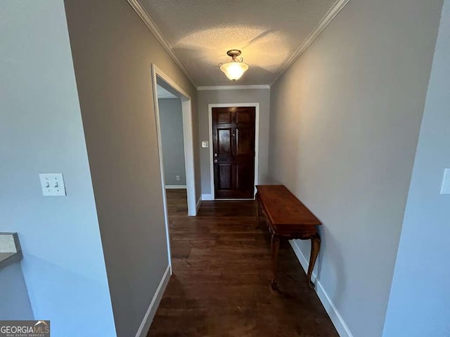 doorway to outside with crown molding, dark hardwood / wood-style floors, and a textured ceiling