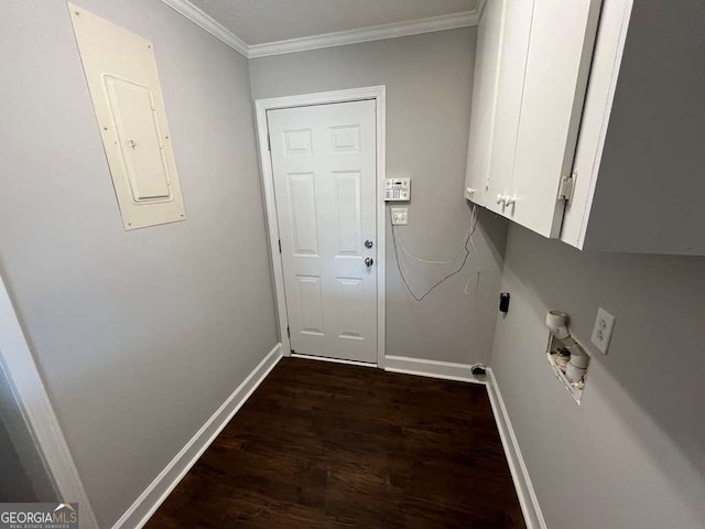 laundry room featuring cabinets, ornamental molding, electric panel, electric dryer hookup, and dark wood-type flooring