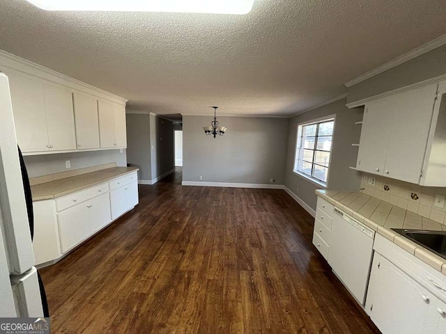 kitchen with white cabinetry, dark hardwood / wood-style flooring, tile countertops, and decorative light fixtures