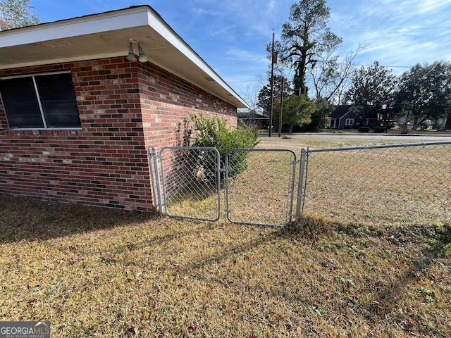 view of side of home with a lawn