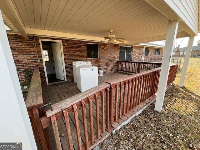 wooden terrace with washer / clothes dryer and ceiling fan