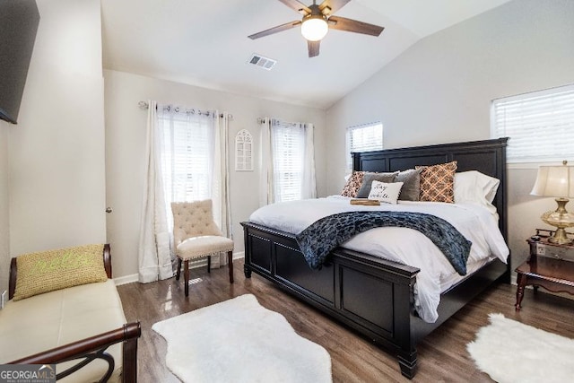 bedroom featuring lofted ceiling, dark hardwood / wood-style floors, and ceiling fan