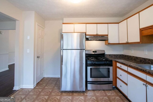 unfurnished bedroom with carpet flooring and a textured ceiling