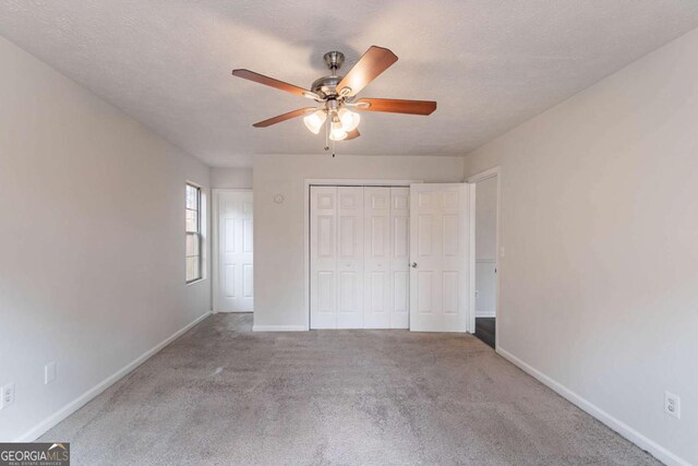 full bathroom with vanity, a textured ceiling, toilet, and washtub / shower combination