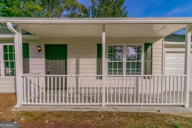 doorway to property with a porch