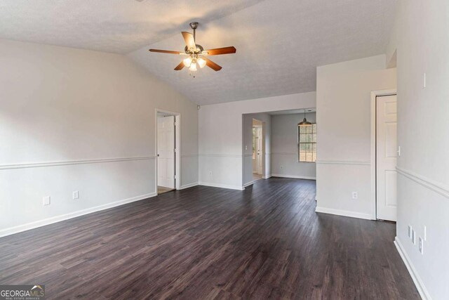 spare room featuring ceiling fan, dark hardwood / wood-style floors, and a textured ceiling