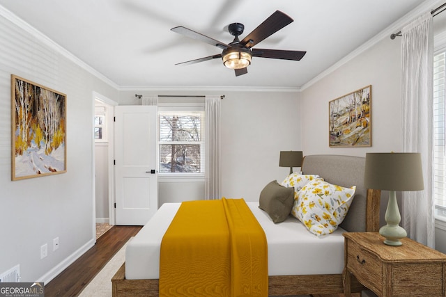 bedroom with ceiling fan, ornamental molding, and dark hardwood / wood-style flooring