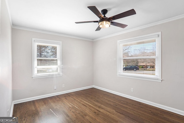 unfurnished room featuring plenty of natural light, ceiling fan, dark hardwood / wood-style floors, and ornamental molding