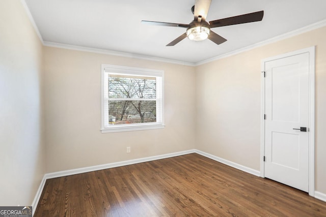 spare room featuring ceiling fan, crown molding, and dark hardwood / wood-style floors