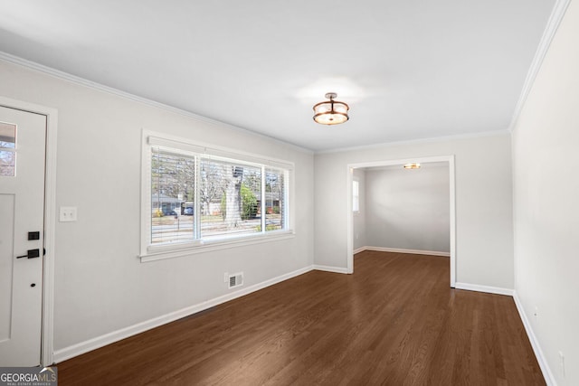 interior space featuring dark wood-type flooring and ornamental molding