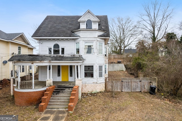 victorian house featuring a porch