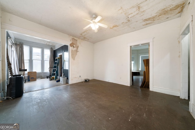 spare room with ceiling fan and dark hardwood / wood-style flooring