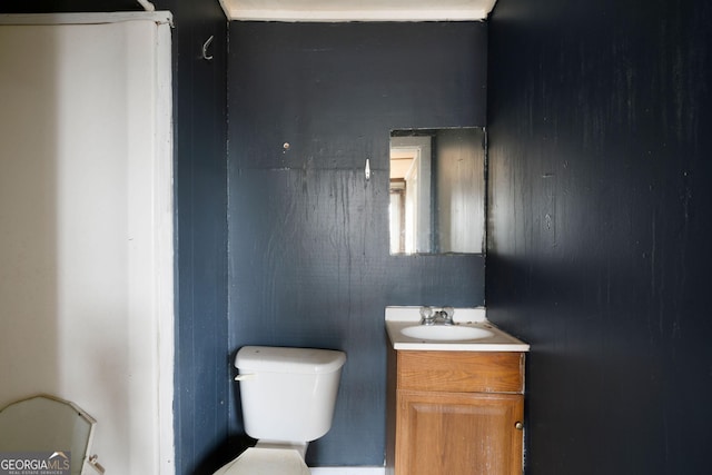 bathroom featuring vanity and toilet