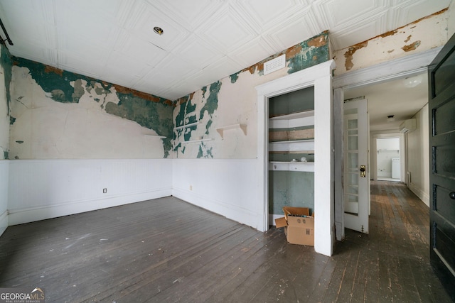 unfurnished room featuring dark hardwood / wood-style flooring