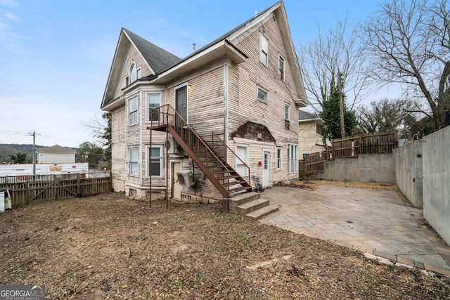 rear view of property with a patio area