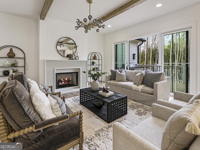 living room featuring a notable chandelier, beam ceiling, and wood-type flooring