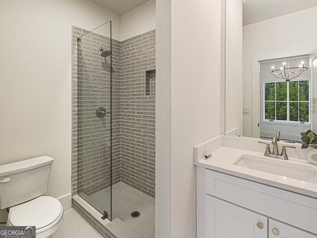 bathroom with walk in shower, vanity, toilet, and a chandelier