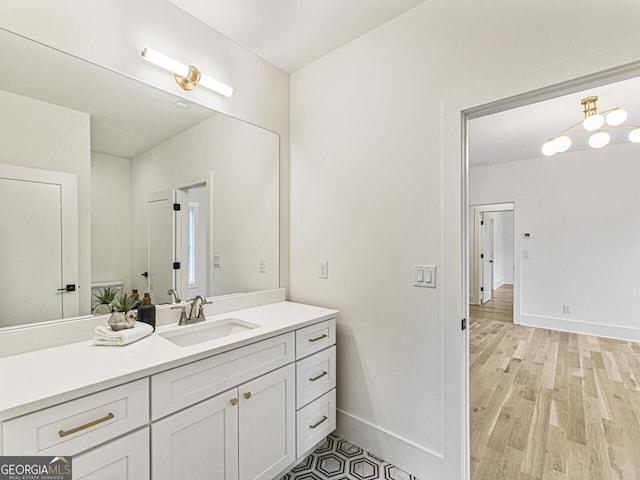 bathroom with wood-type flooring and vanity