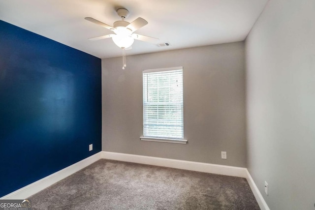 carpeted empty room with ceiling fan