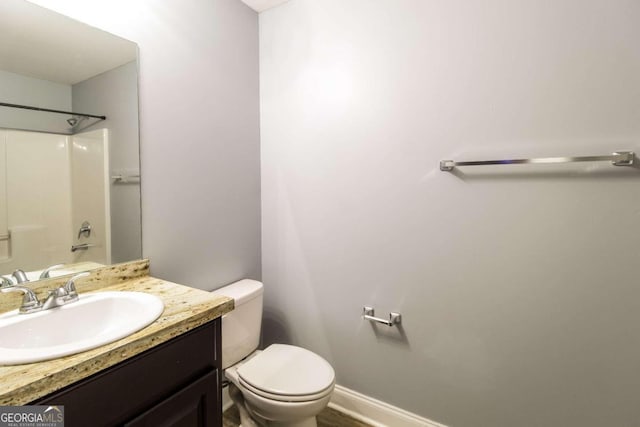 full bathroom with vanity, shower / bathing tub combination, and toilet