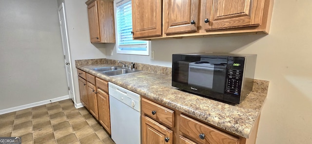 kitchen with dishwasher and sink