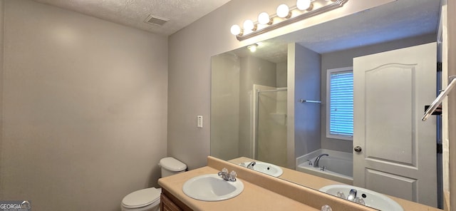 full bathroom featuring shower with separate bathtub, vanity, a textured ceiling, and toilet