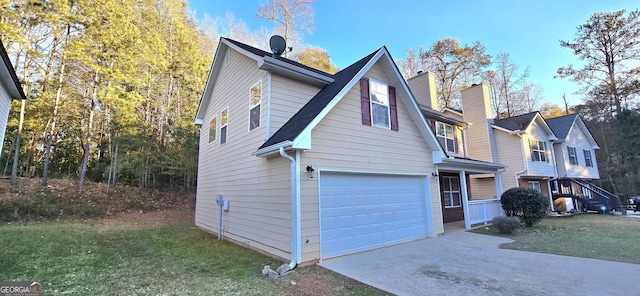 view of front of house with a garage and a front yard