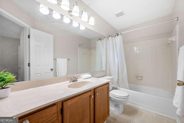 full bathroom featuring vanity, tile patterned flooring, toilet, and shower / bath combo with shower curtain