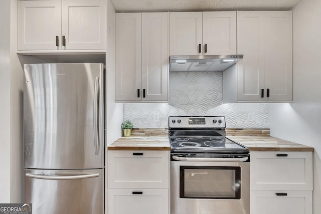 5833 Westerling Pl, Powder Springs, GA 30127 - kitchen with butcher block countertops, appliances with stainless steel finishes, under cabinet range hood, and white cabinets