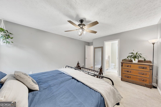 5833 Westerling Pl, Powder Springs, GA 30127 - bedroom featuring light colored carpet, ensuite bath, ceiling fan, baseboards, and a textured ceiling