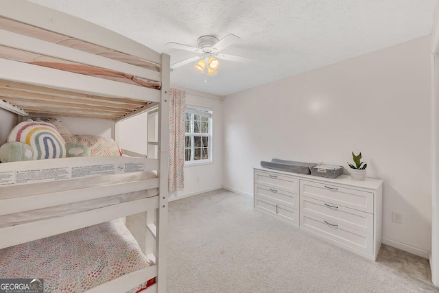5833 Westerling Pl, Powder Springs, GA 30127 - bedroom with light carpet, baseboards, ceiling fan, and a textured ceiling