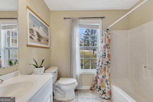 5833 Westerling Pl, Powder Springs, GA 30127 - full bath featuring healthy amount of natural light, toilet, vanity, and shower / bath combo with shower curtain