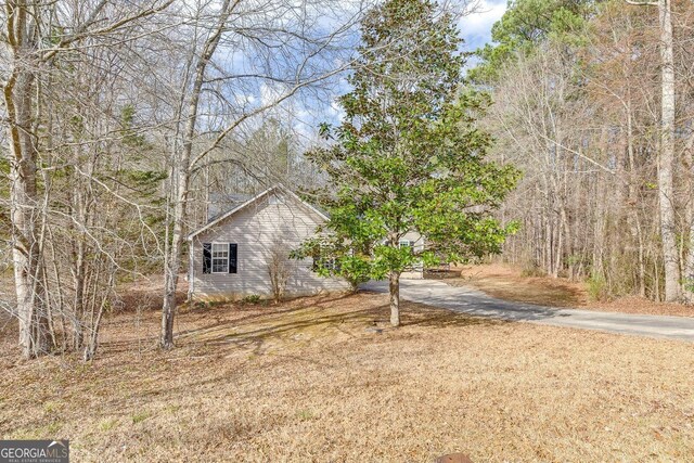 5833 Westerling Pl, Powder Springs, GA 30127 - view of yard featuring asphalt driveway