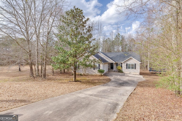 5833 Westerling Pl, Powder Springs, GA 30127 - ranch-style home with concrete driveway and an attached garage