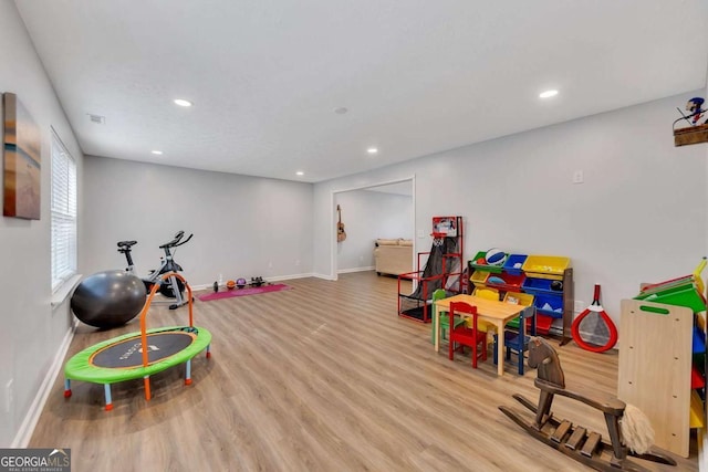 playroom featuring light wood-type flooring