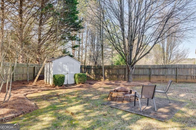 view of yard featuring a storage unit and a fire pit