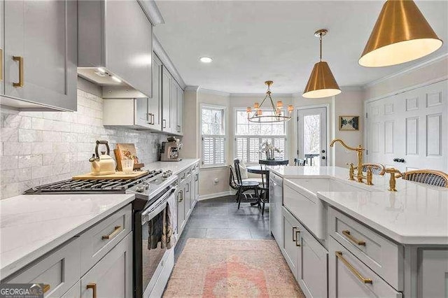 kitchen featuring gray cabinetry, tasteful backsplash, decorative light fixtures, ornamental molding, and appliances with stainless steel finishes