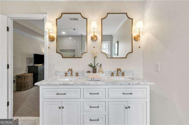 bathroom featuring vanity and ornamental molding