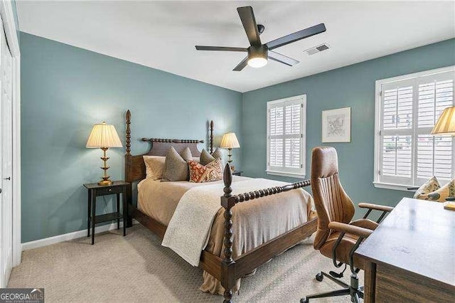 carpeted bedroom with ceiling fan