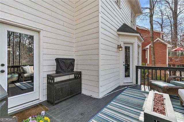 doorway to property featuring a wooden deck