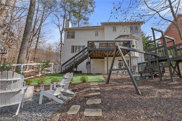 back of property with a wooden deck