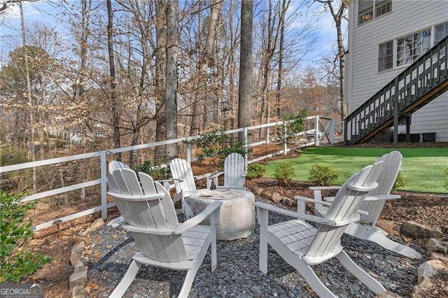 view of patio / terrace featuring an outdoor fire pit